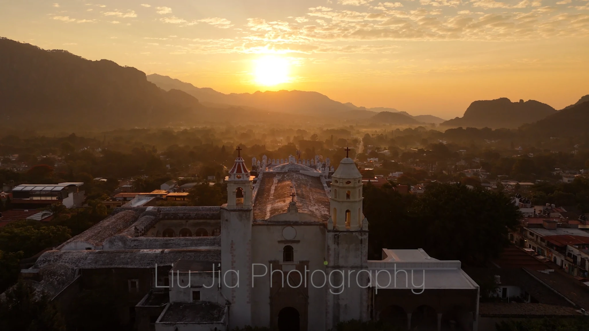 An aerial view of a Mexican town at sunset