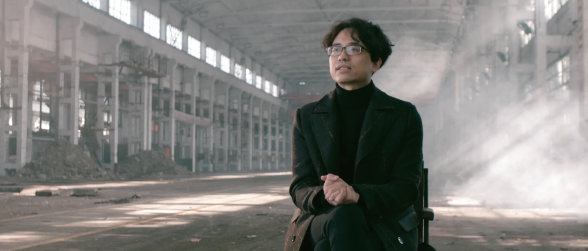 A person inside the industrial hall in the Xinyefang film
